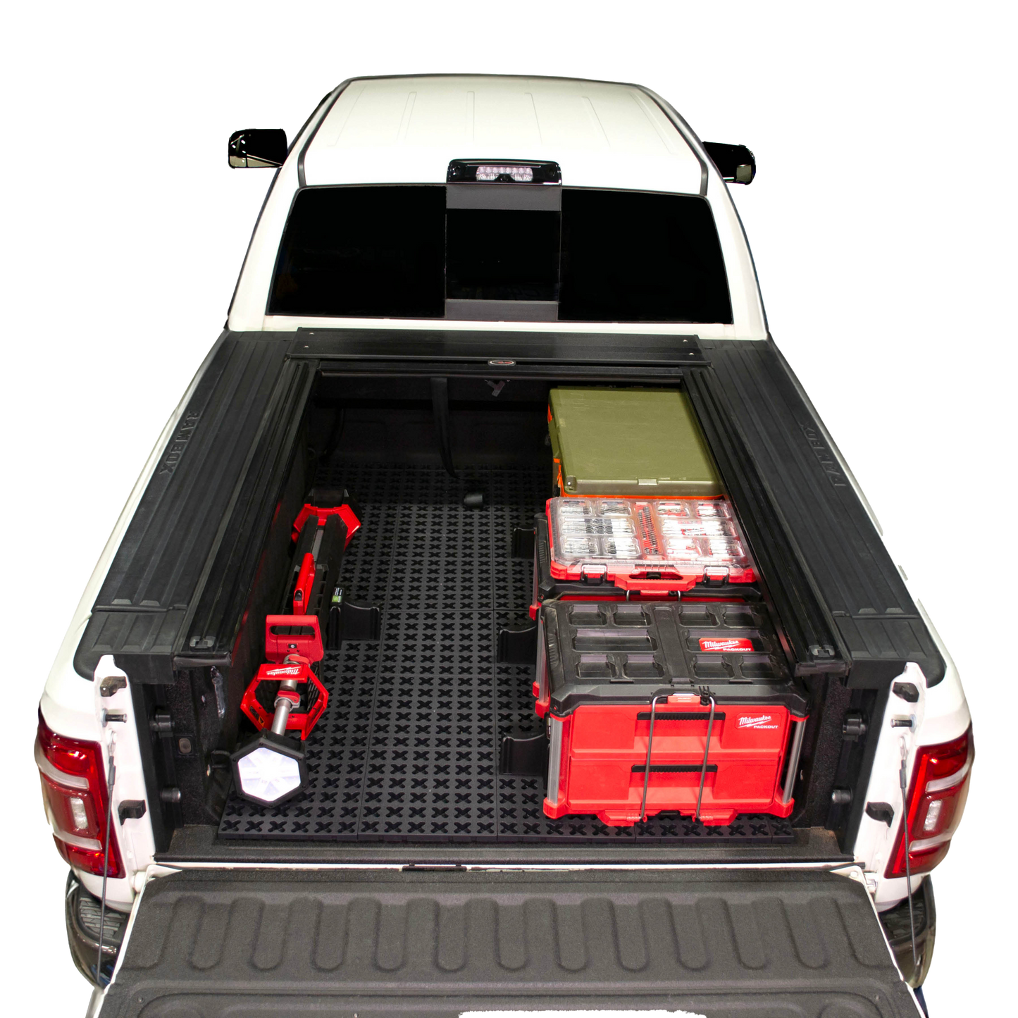 GMC short bed truck with Tmat securing boxes and a cooler