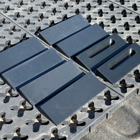 A set of Tmat ramp pieces laying onto of a Tmat system.