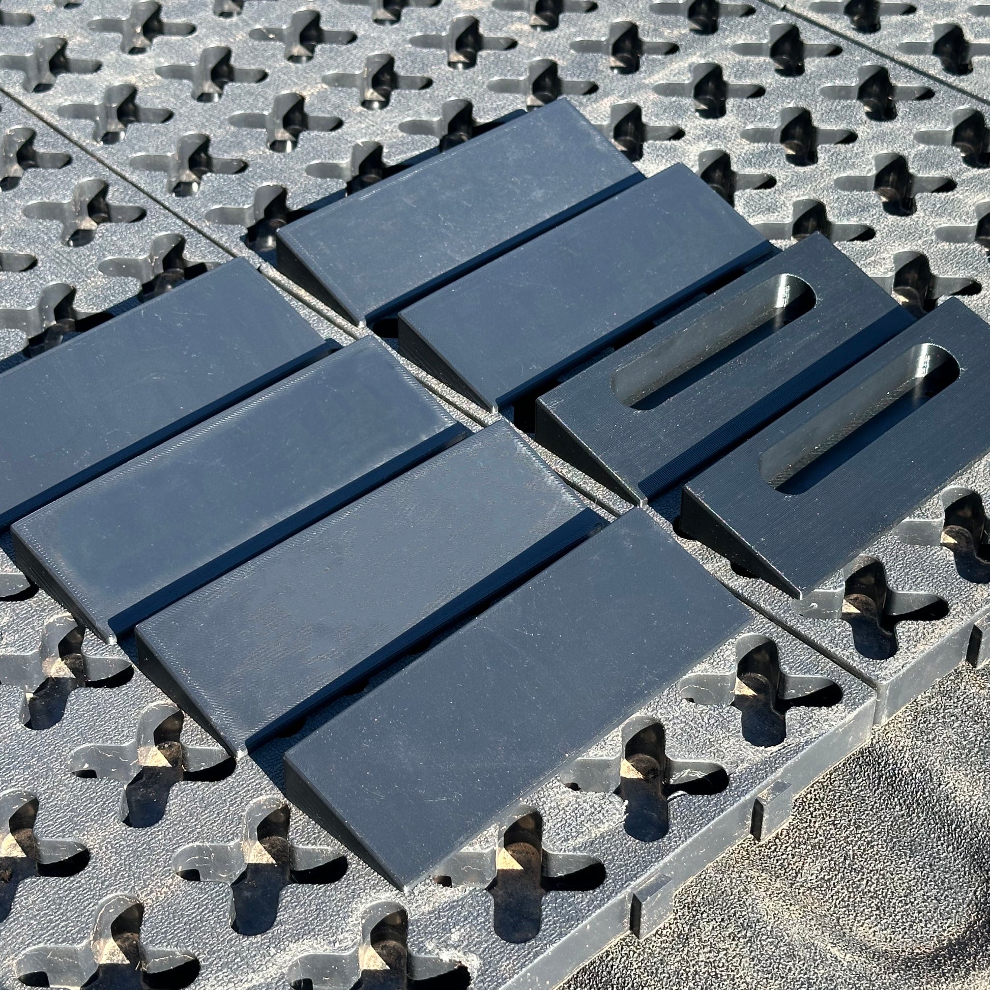 A set of Tmat ramp pieces laying onto of a Tmat system.