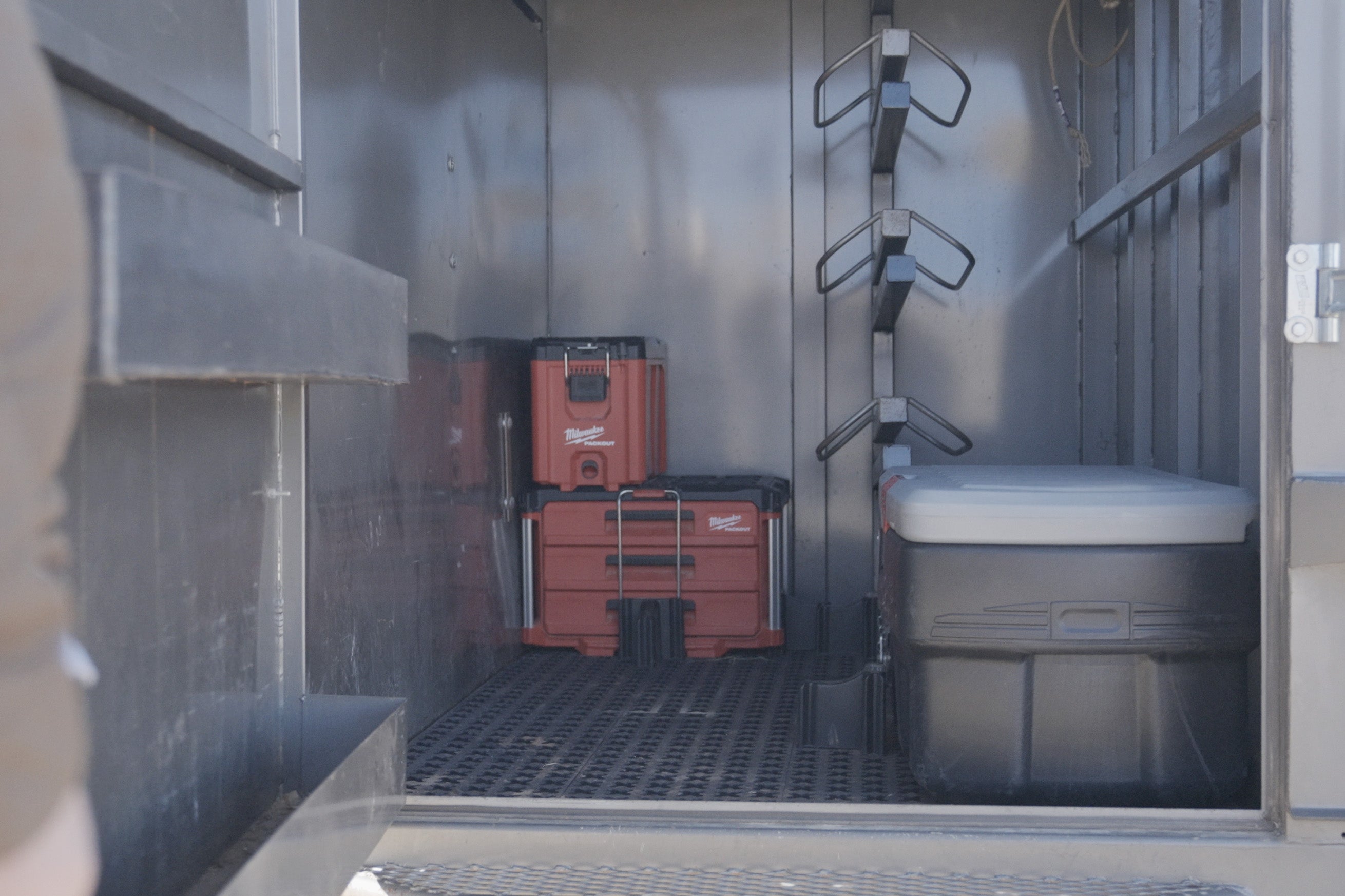 Tmat installed into the tac room with red Packout tool boxes and an ActionPacker container.
