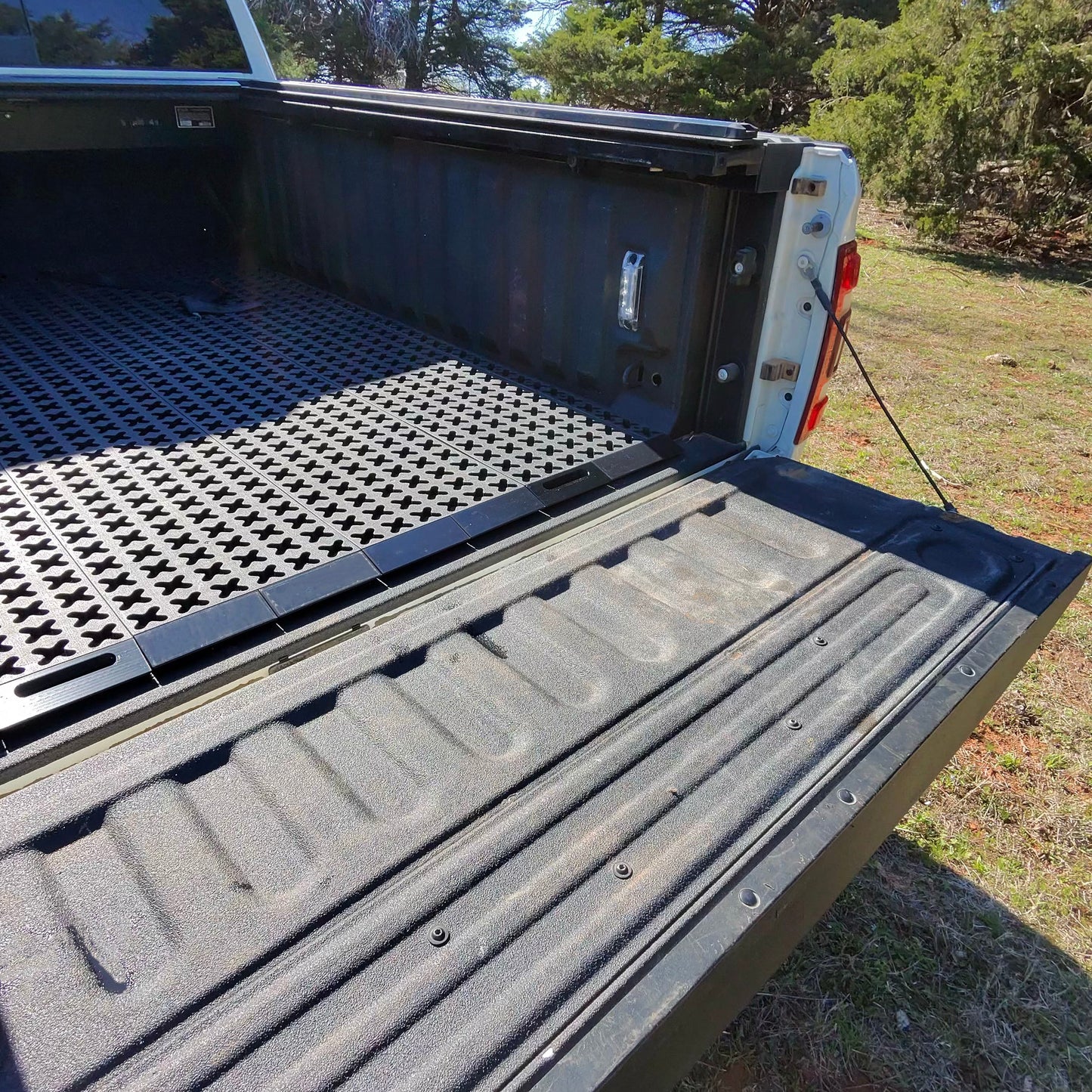 Tmat ramp set installed into a Tmat in the back of a pickup.