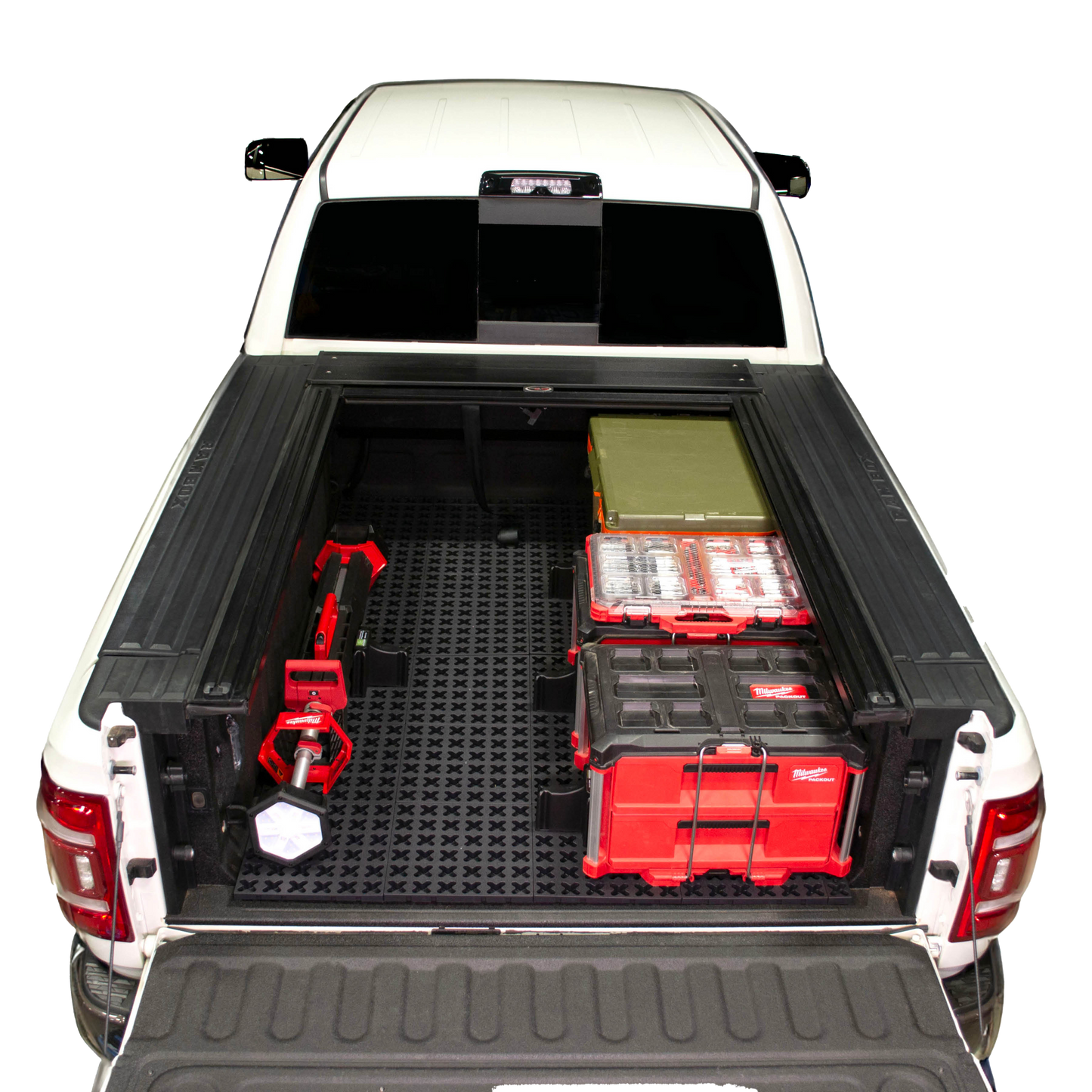 Tmat in Ram truck bed with Milwaukee Packouts, a Rtic cooler, and Milwaukee shop light.